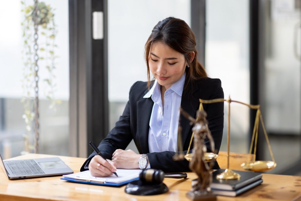 Legal secretary in California expertly managing phone calls and scheduling appointments
